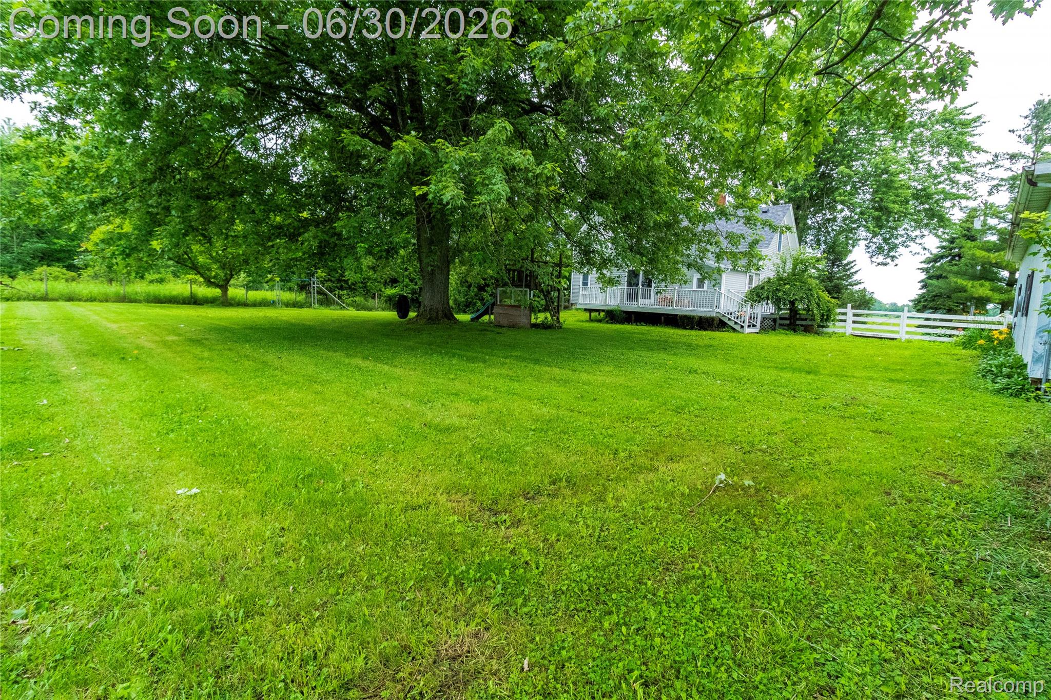 8150 Norman Road Imlay City, MI 48444 - Photo 44 of 58 Expansive green lawn with mature trees providing shade