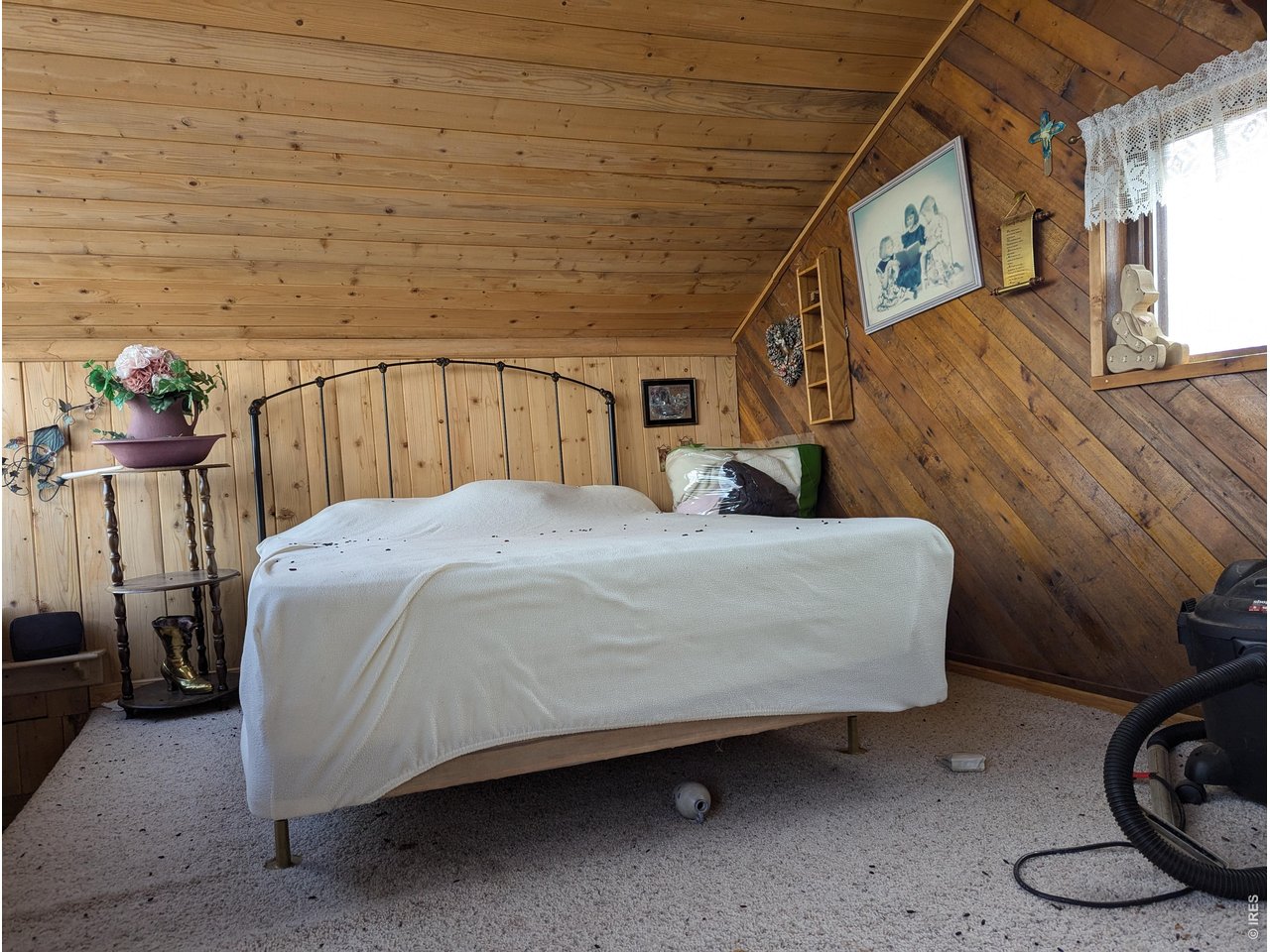 9400 Canal Road Glade Park, CO 81523 - Photo 13 of 14 a bed sitting in a room next to a window