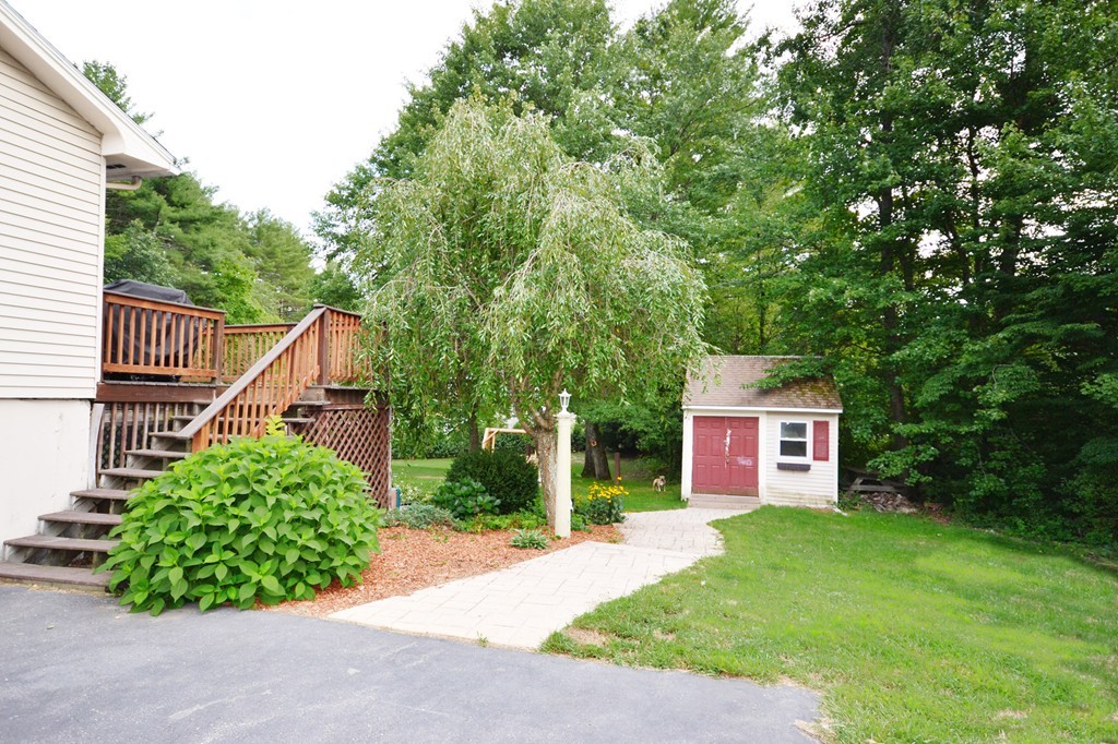 10 Mulpus Road Shirley, MA 01464 - Photo 3 of 23 a view of a house with a yard and plants