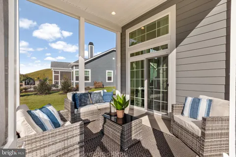a view of a patio with couches chairs dining table and chairs