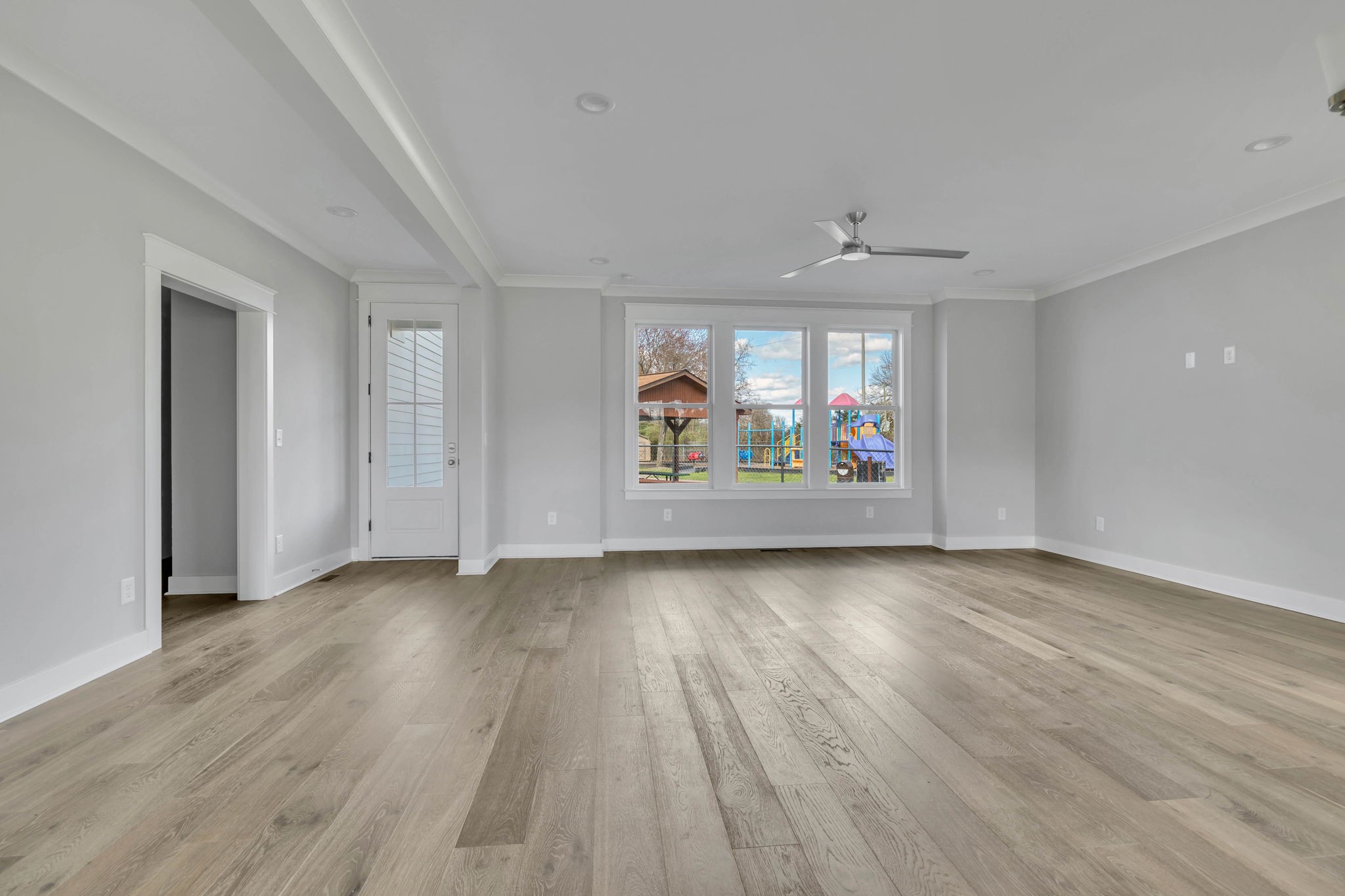 142 Strahl Street Franklin, TN 37064 - Photo 11 of 51 an empty room with wooden floor and windows