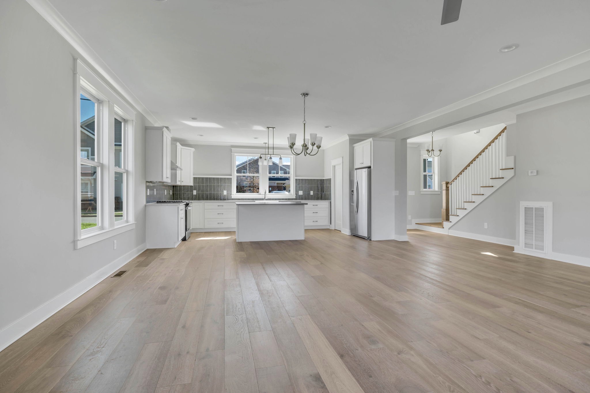 142 Strahl Street Franklin, TN 37064 - Photo 20 of 51 a view of a kitchen with wooden floor and windows