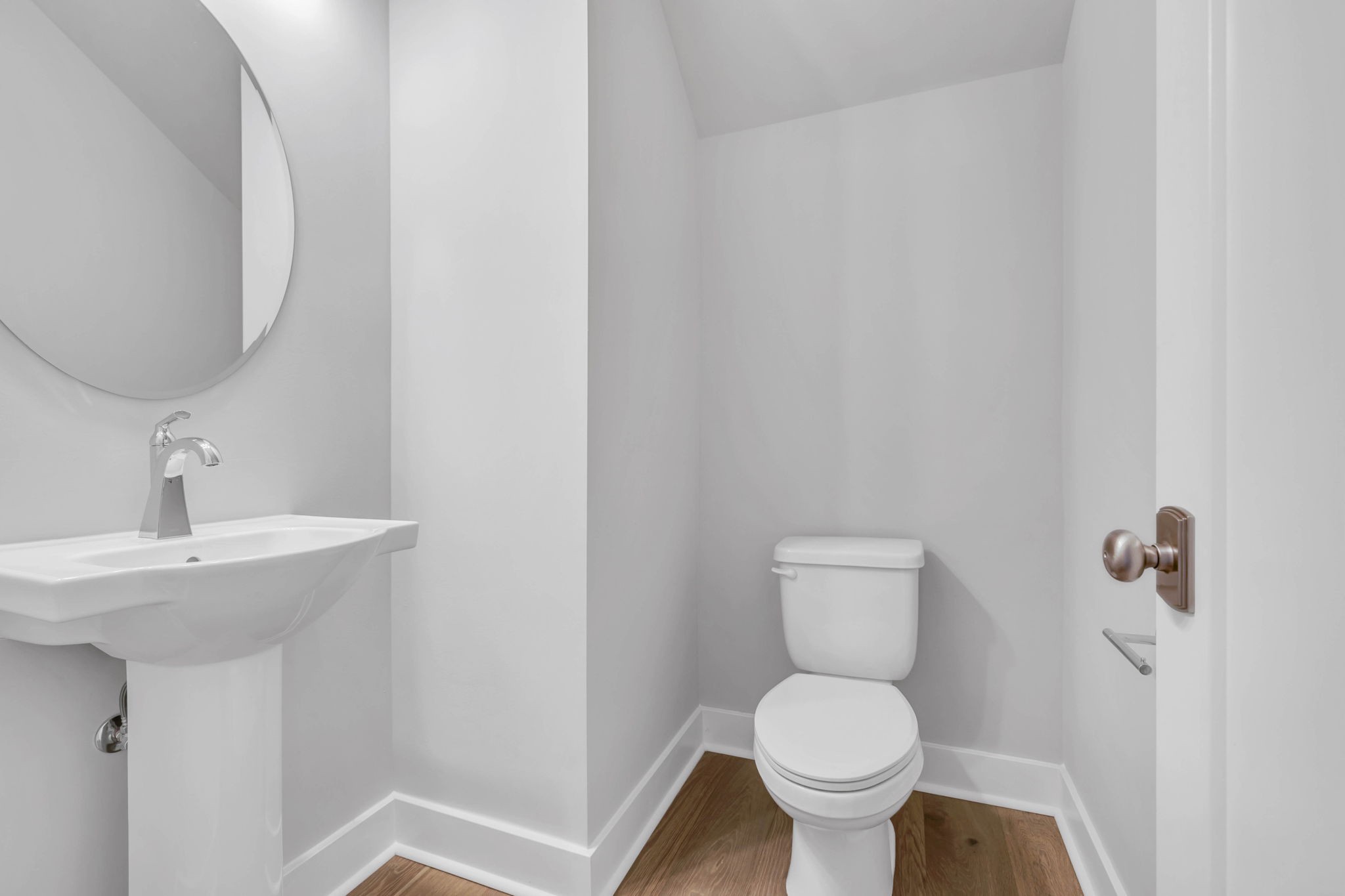142 Strahl Street Franklin, TN 37064 - Photo 22 of 51 a white toilet sitting next to a bathroom sink