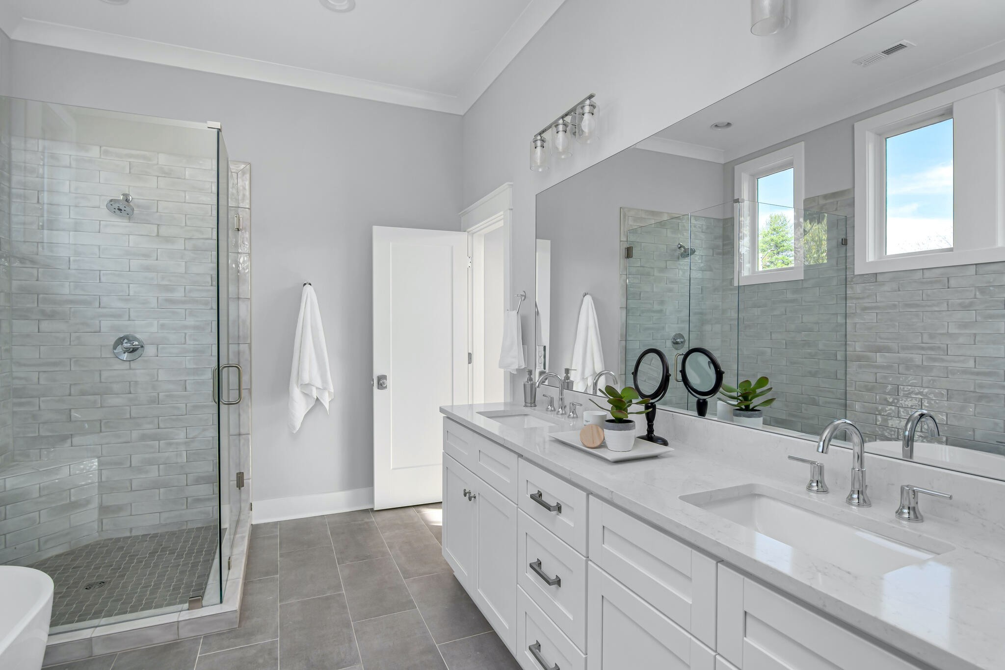 142 Strahl Street Franklin, TN 37064 - Photo 28 of 51 a bathroom with double vanity sinks and a shower