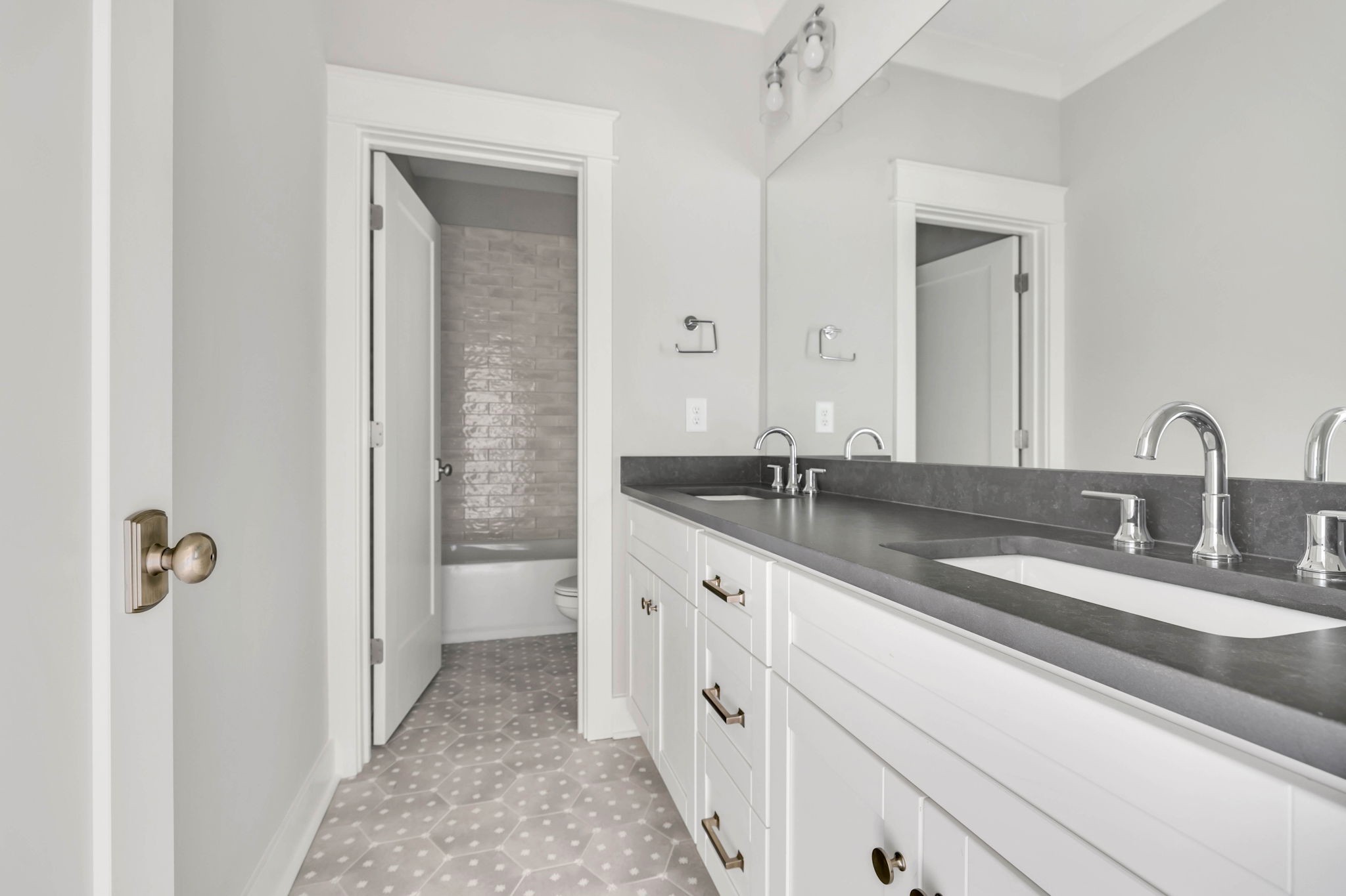142 Strahl Street Franklin, TN 37064 - Photo 35 of 51 a bathroom with a double vanity sink and a mirror