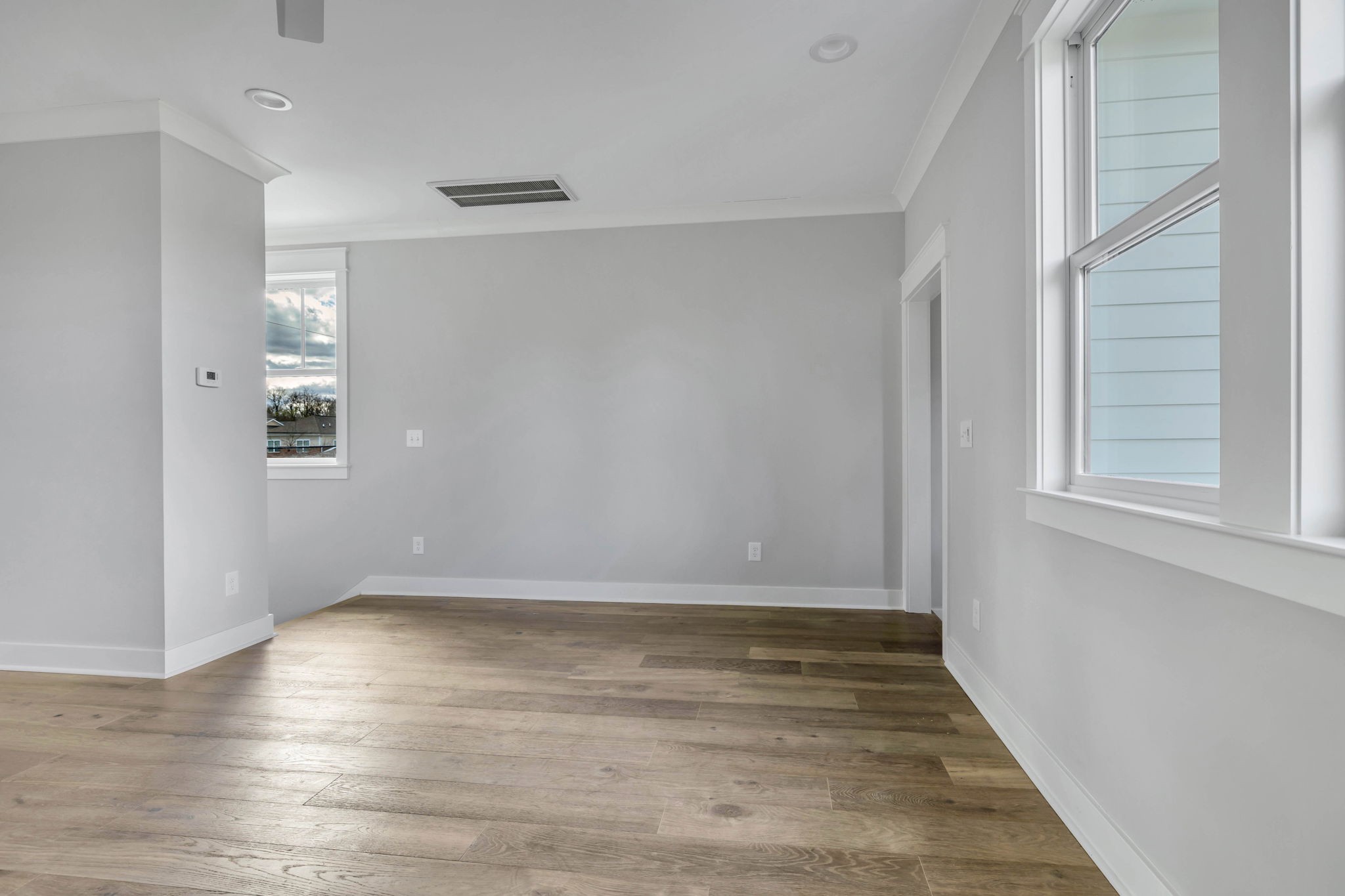 142 Strahl Street Franklin, TN 37064 - Photo 40 of 51 a view of an empty room with wooden floor and a window