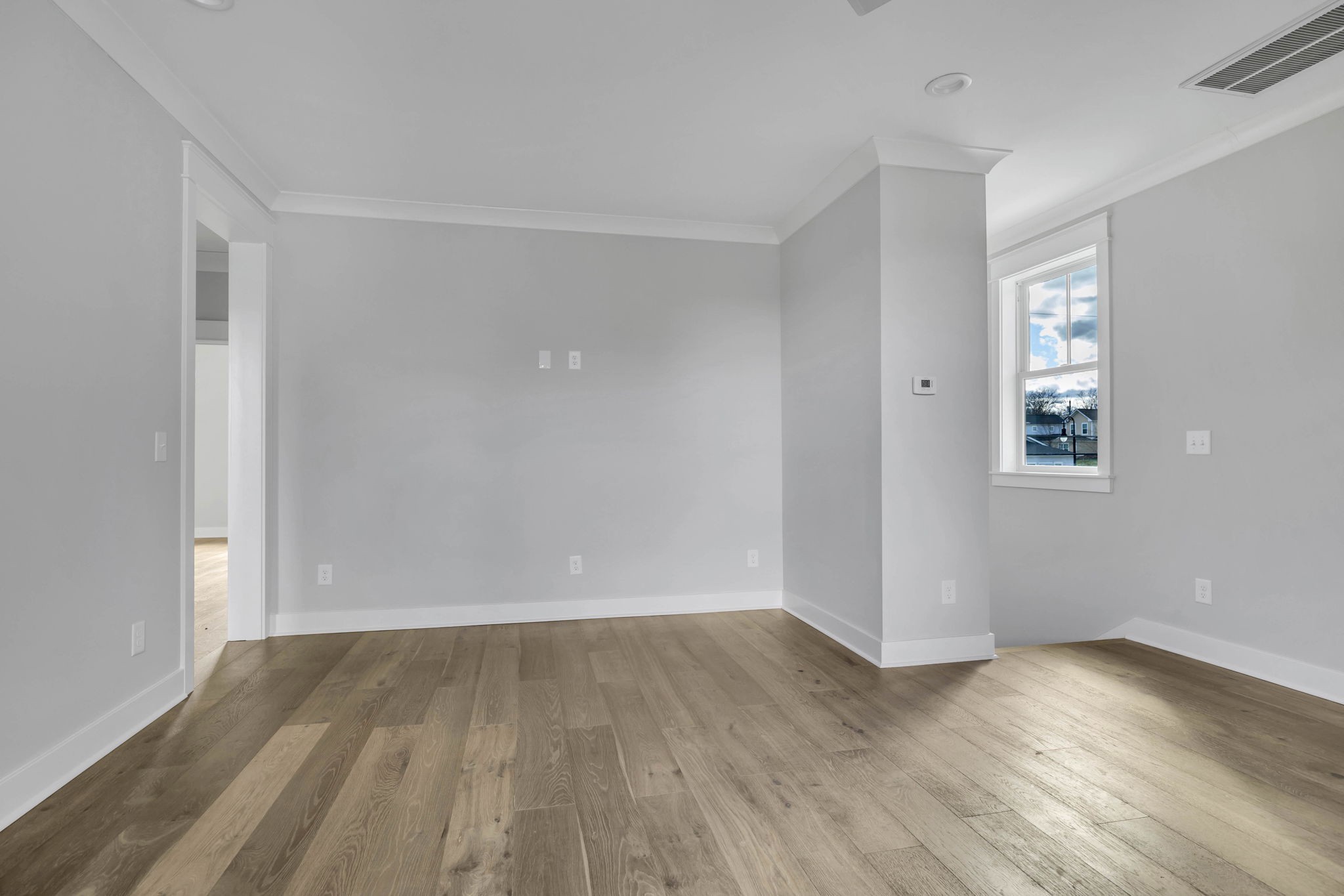 142 Strahl Street Franklin, TN 37064 - Photo 42 of 51 an empty room with wooden floor and windows
