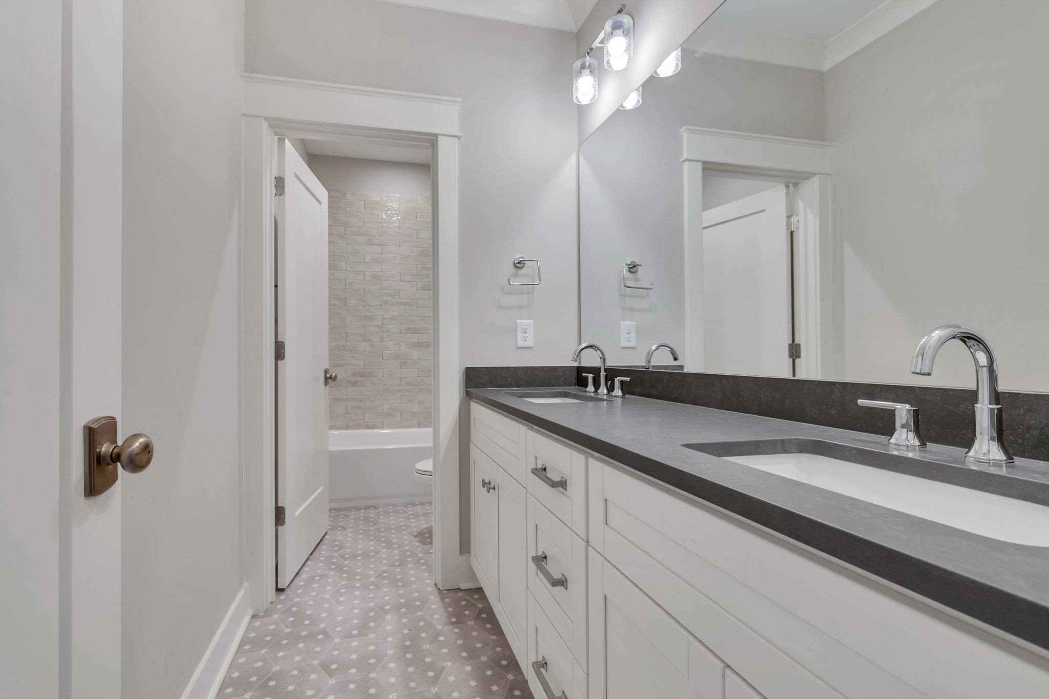 142 Strahl Street Franklin, TN 37064 - Photo 43 of 51 a bathroom with a double vanity sink a toilet and a mirror