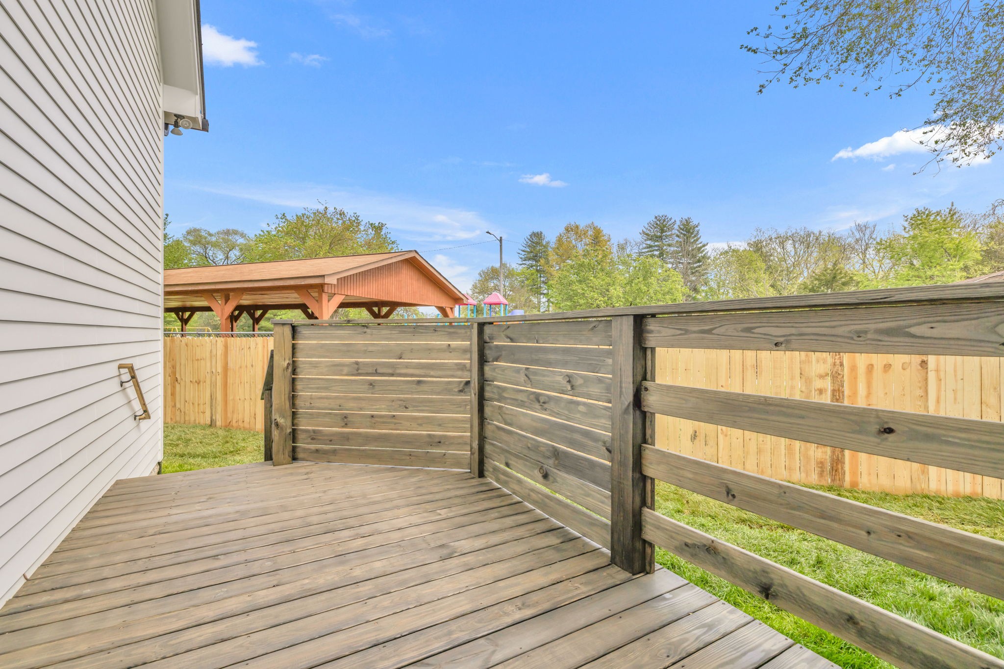 142 Strahl Street Franklin, TN 37064 - Photo 48 of 51 a view of a balcony with wooden floor and city view