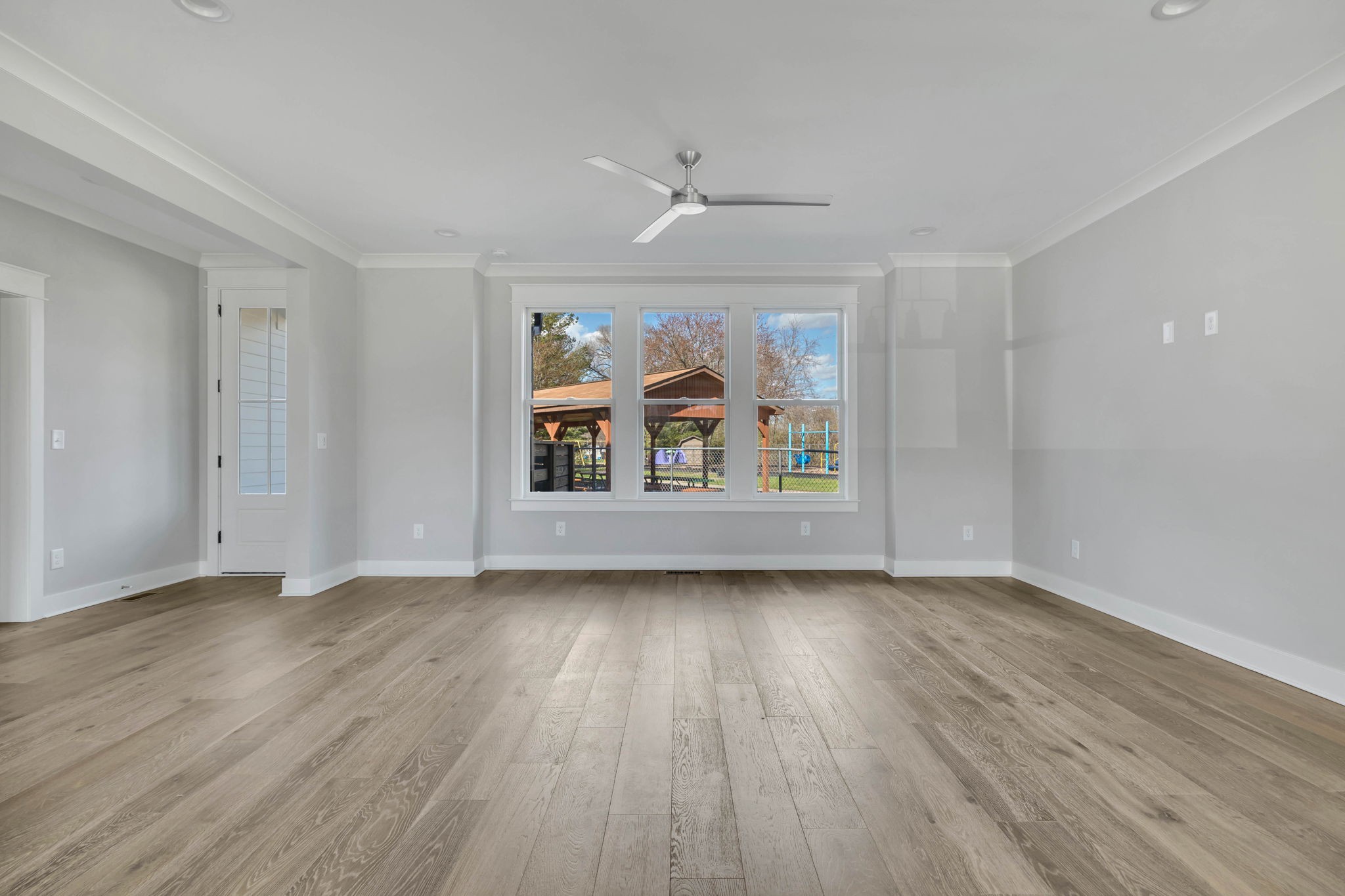 142 Strahl Street Franklin, TN 37064 - Photo 9 of 51 wooden floor in an empty room with a window