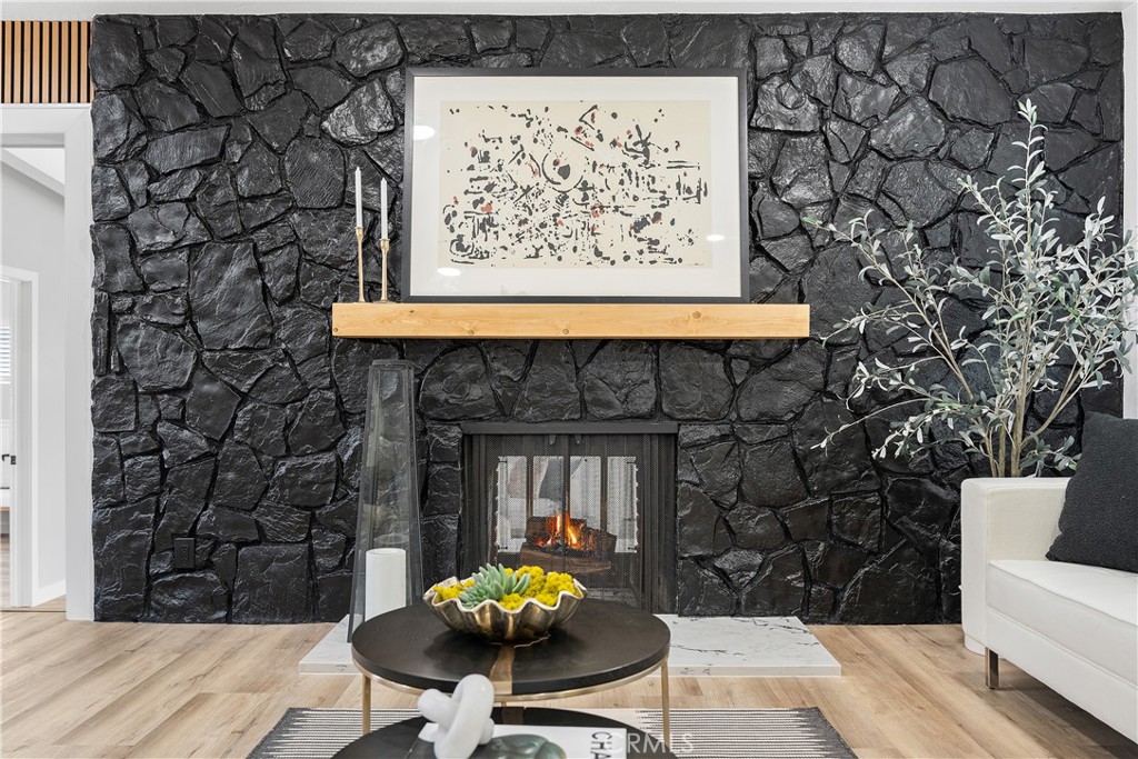 12748 Paramount Boulevard Downey, CA 90242 - Photo 18 of 72 a living room with a couch and a fireplace