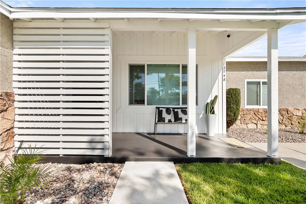 12748 Paramount Boulevard Downey, CA 90242 - Photo 2 of 72 a view of a entryway front of house