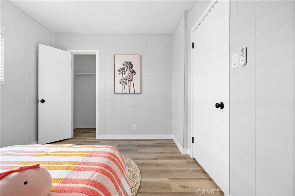 12748 Paramount Boulevard Downey, CA 90242 - Photo 26 of 72 a bedroom with a bed and painting on the wall