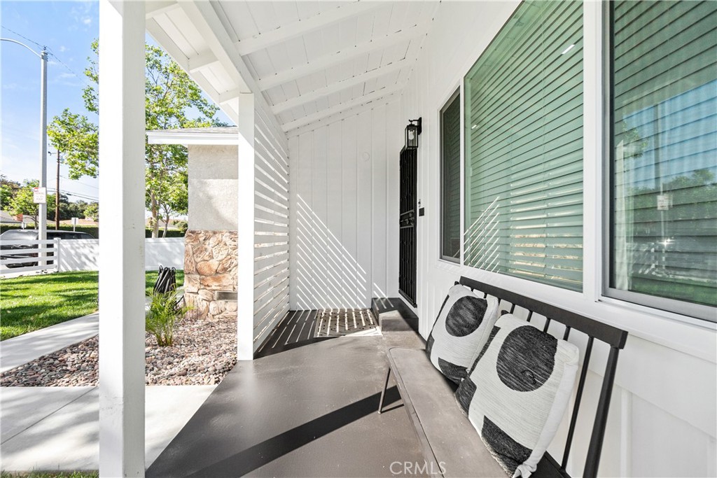12748 Paramount Boulevard Downey, CA 90242 - Photo 3 of 72 a view of a door and chair in the balcony
