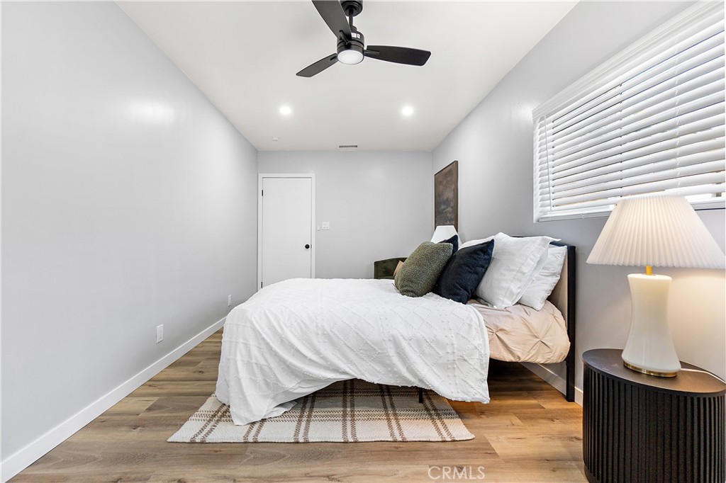 12748 Paramount Boulevard Downey, CA 90242 - Photo 35 of 72 a bedroom with a bed and a night stand