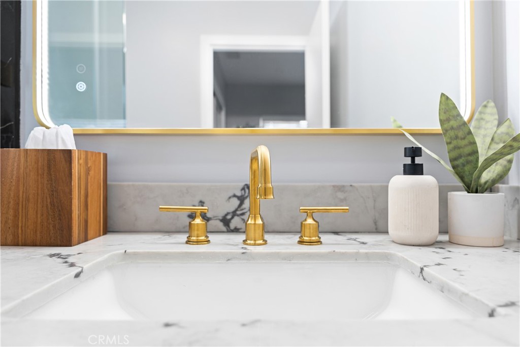 12748 Paramount Boulevard Downey, CA 90242 - Photo 38 of 72 a bathroom with a sink and a mirror