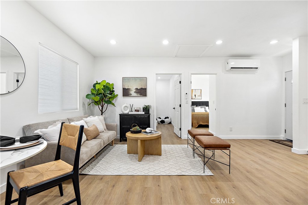 12748 Paramount Boulevard Downey, CA 90242 - Photo 55 of 72 a living room with furniture and a rug