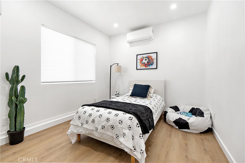 12748 Paramount Boulevard Downey, CA 90242 - Photo 59 of 72 a bedroom with a bed and a window