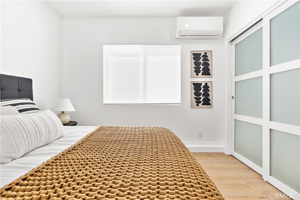 12748 Paramount Boulevard Downey, CA 90242 - Photo 62 of 72 a bedroom with a bed and a window