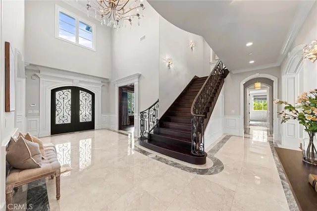 a view of an entryway with wooden floor