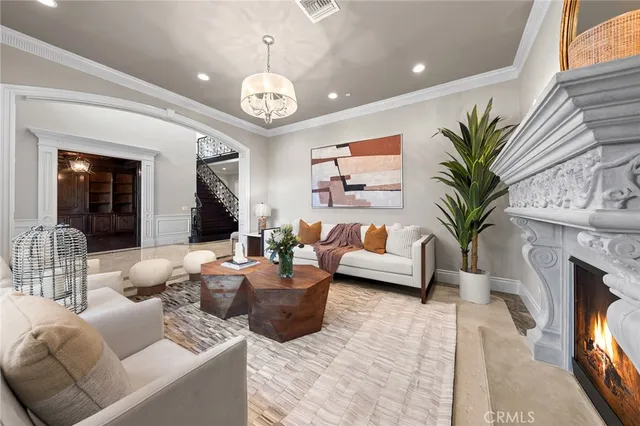 a living room with furniture and a potted plant