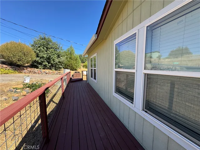 a view of balcony with wooden floor