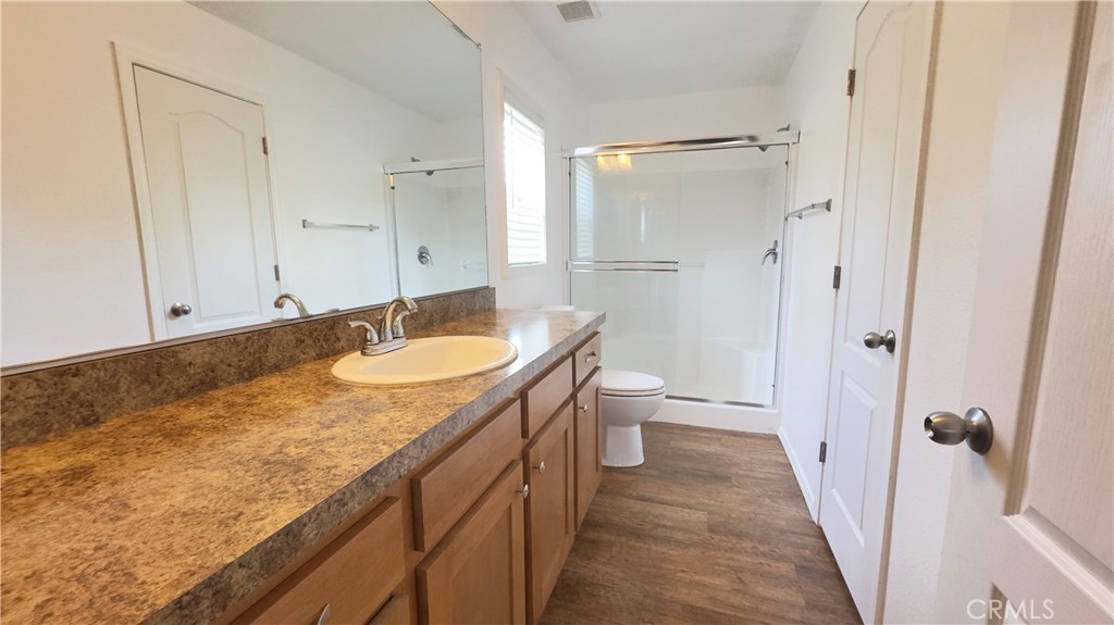 15320 Trinity Road Cobb, CA 95426 - Photo 9 of 13 a bathroom with a granite countertop sink toilet and shower