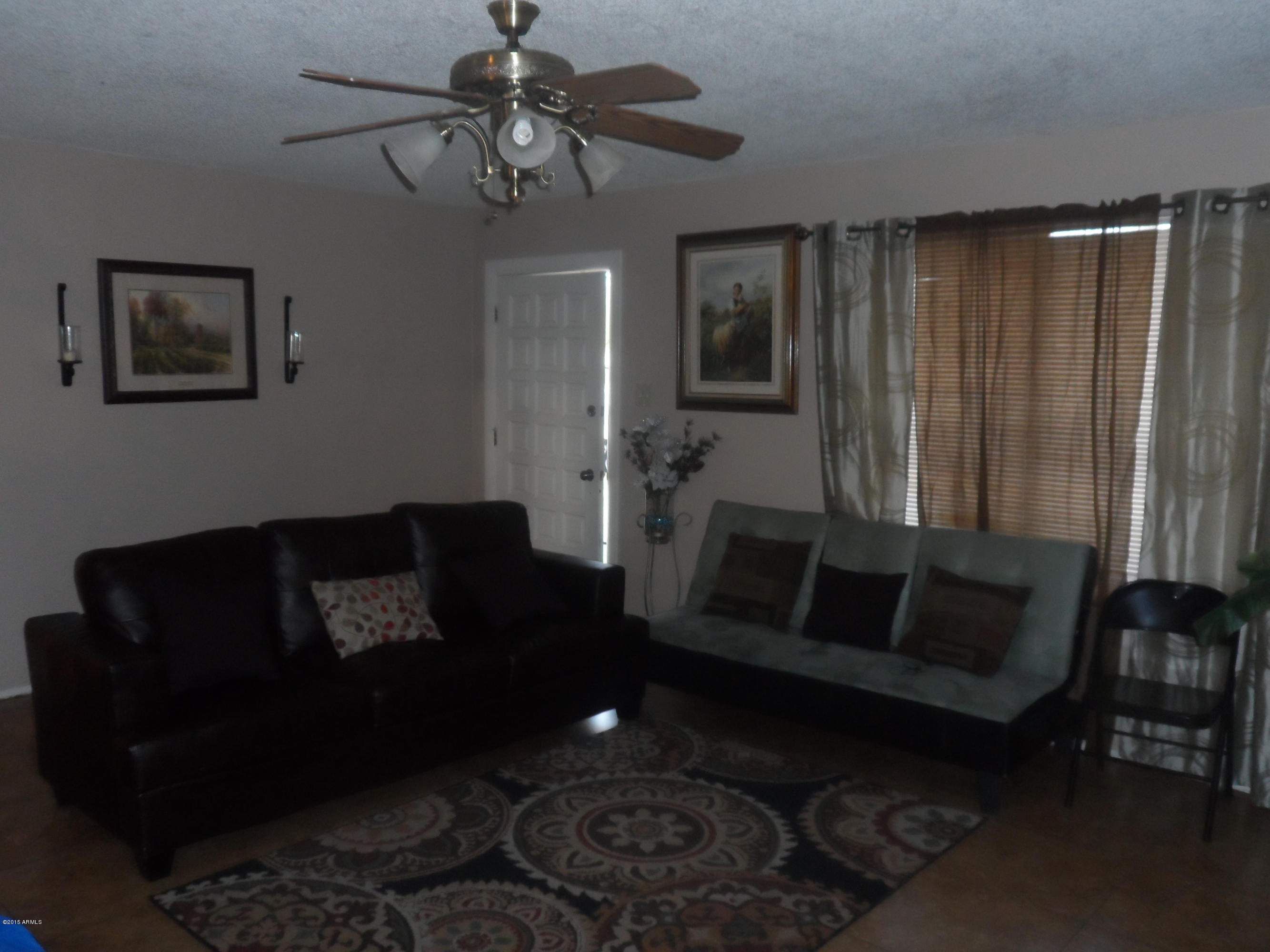 6927 West Camelback Road Phoenix, AZ 85033 - Photo 4 of 23 a living room with furniture and a window