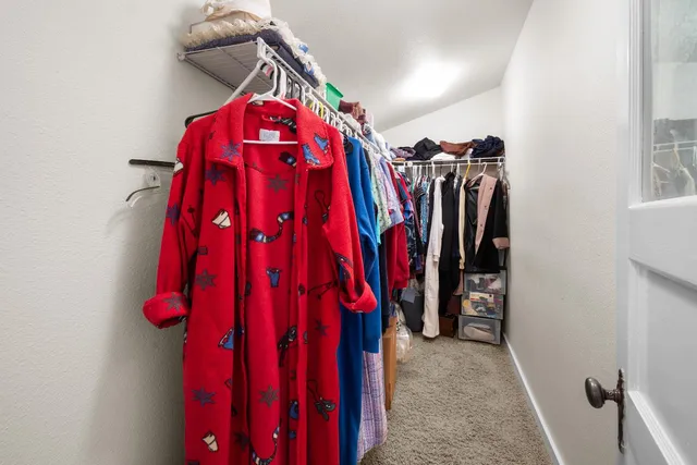 a view of a closet with storage