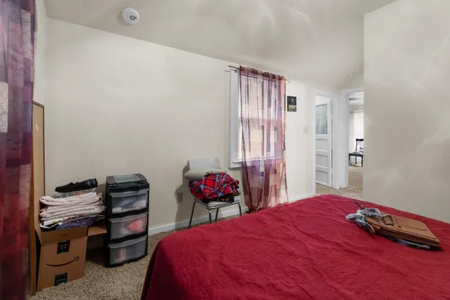 a bedroom with a bed and a closet