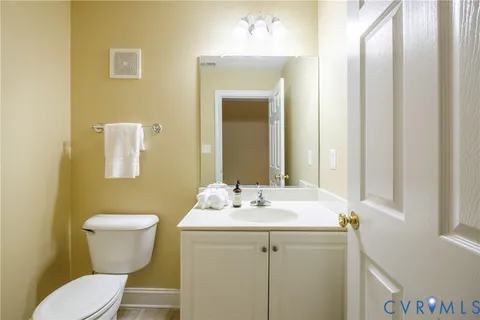 a bedroom with bed and cabinets