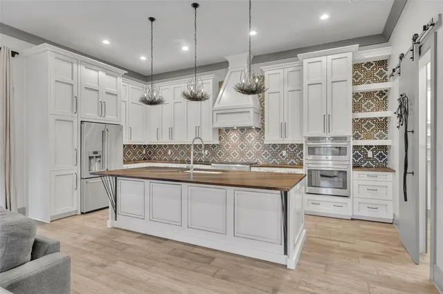 a large kitchen with cabinets