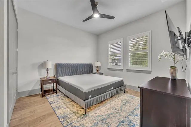 a bedroom with a bed and a table in it