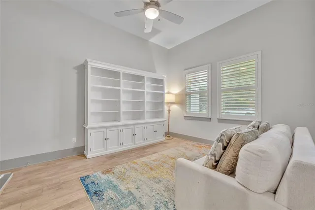 a view of a bedroom with furniture and a window