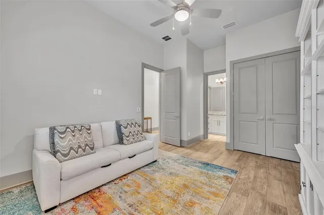 a living room with furniture and a rug