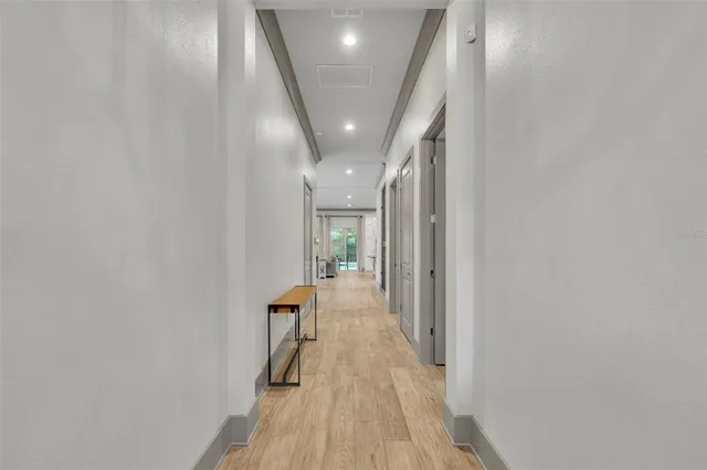 wooden floor in a hall with a window