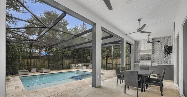 a view of a patio with a table and chairs
