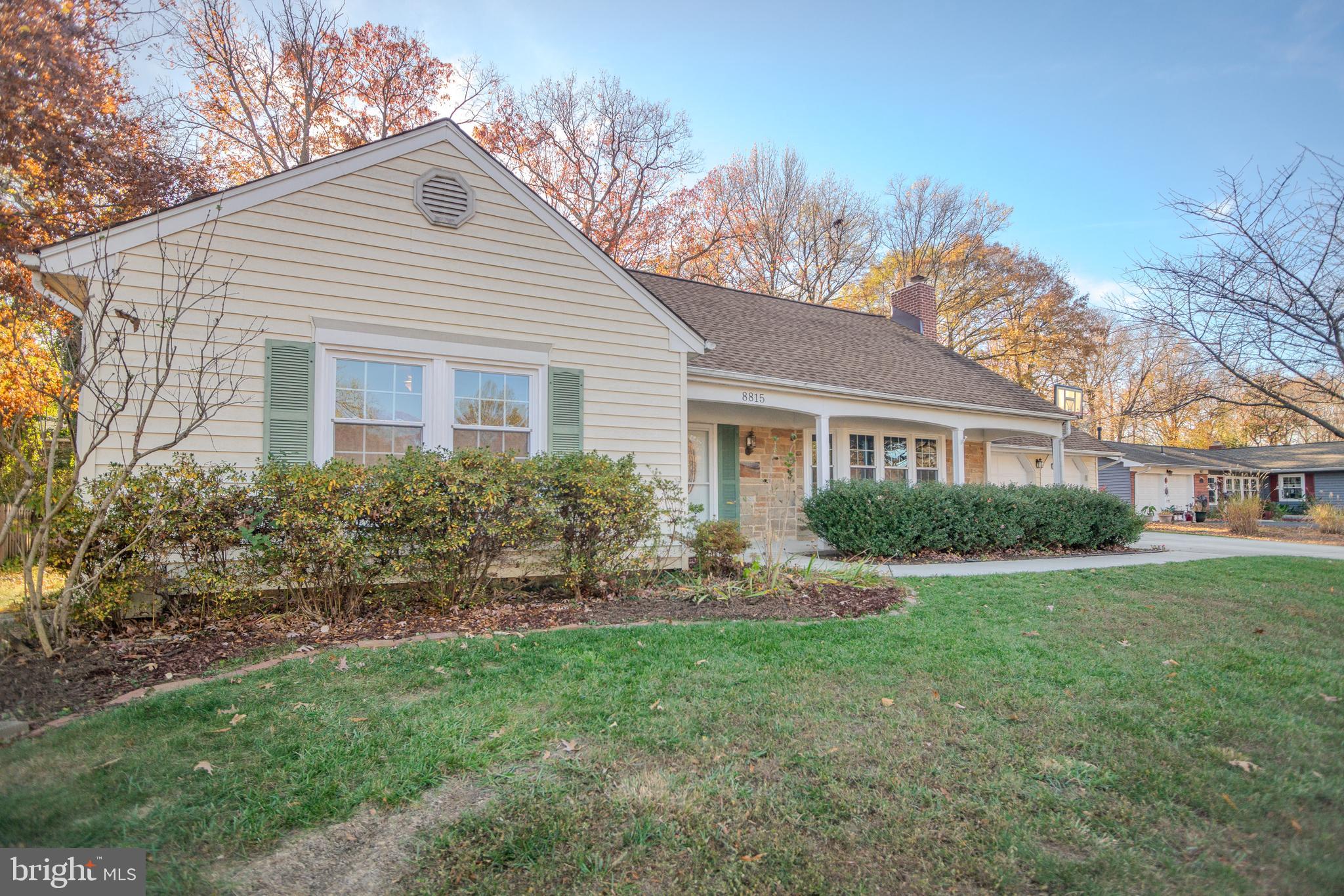 8815 Gramercy Lane Laurel, MD 20708 - Photo 1 of 42 a front view of a house with a yard and trees