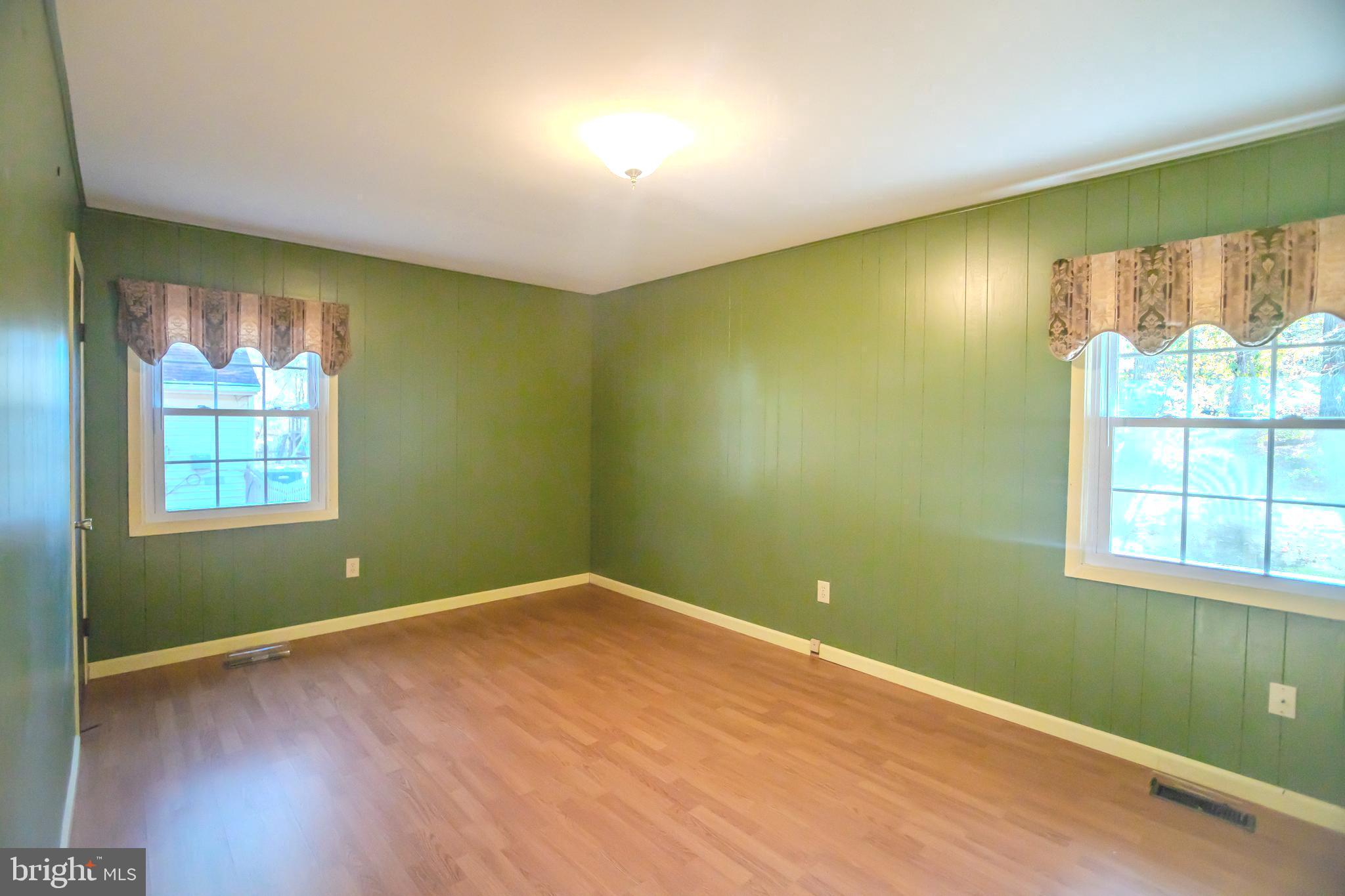 8815 Gramercy Lane Laurel, MD 20708 - Photo 16 of 42 an empty room with windows