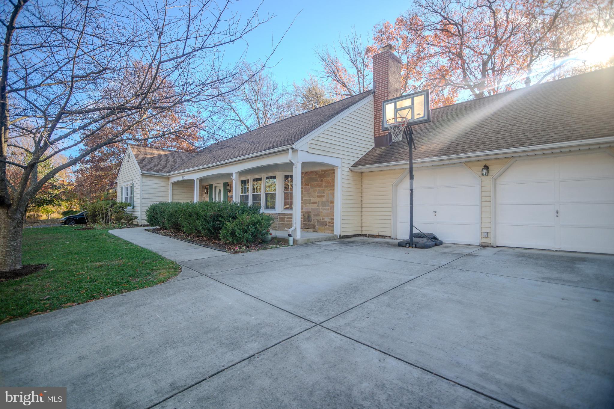 8815 Gramercy Lane Laurel, MD 20708 - Photo 2 of 42 a view of a house with a yard and garage