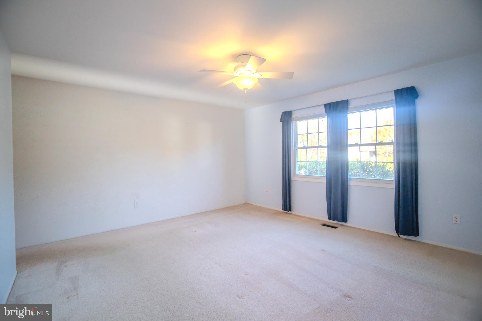 8815 Gramercy Lane Laurel, MD 20708 - Photo 21 of 42 a view of an empty room with a window