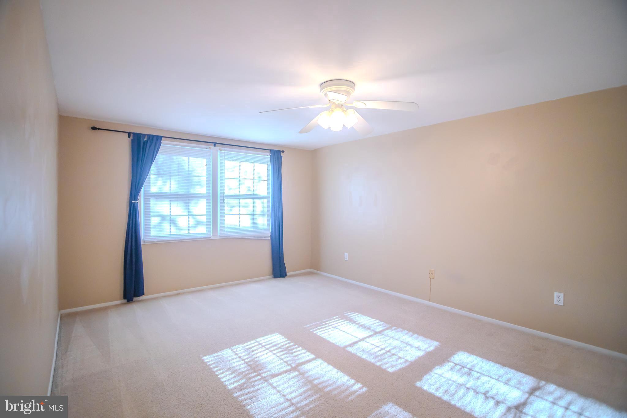 8815 Gramercy Lane Laurel, MD 20708 - Photo 23 of 42 a view of an empty room with a window