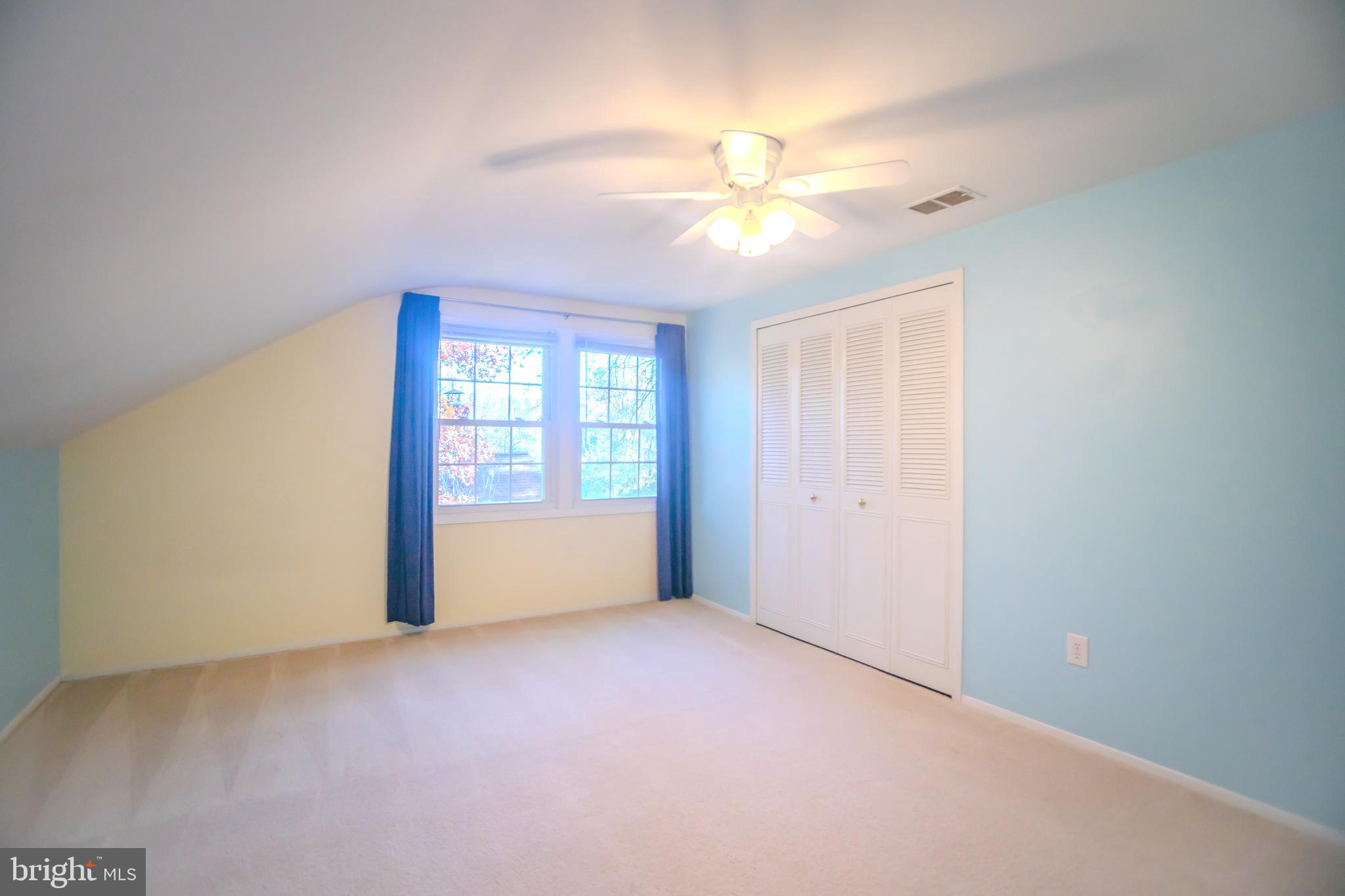 8815 Gramercy Lane Laurel, MD 20708 - Photo 26 of 42 a view of an empty room with a window