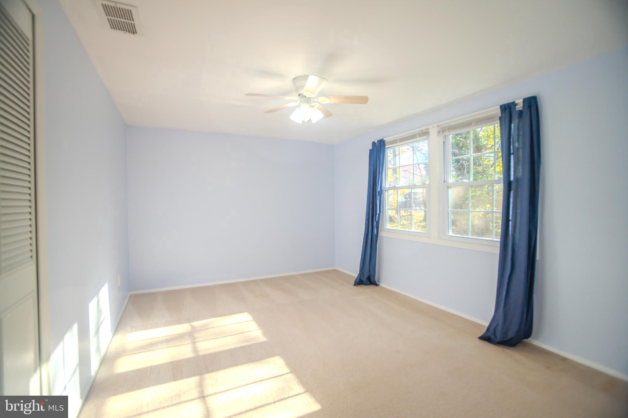 8815 Gramercy Lane Laurel, MD 20708 - Photo 27 of 42 a view of an empty room with a window