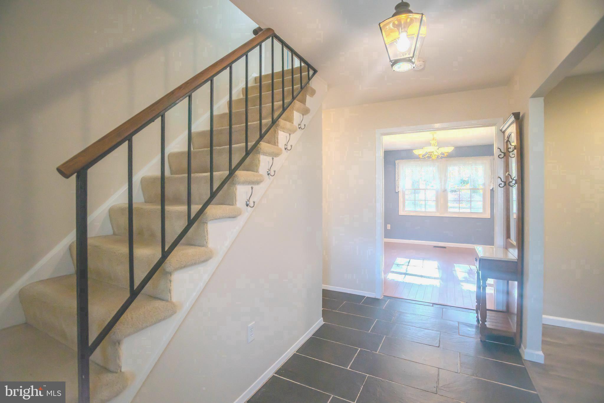 8815 Gramercy Lane Laurel, MD 20708 - Photo 3 of 42 a view of entryway and hall with wooden floor