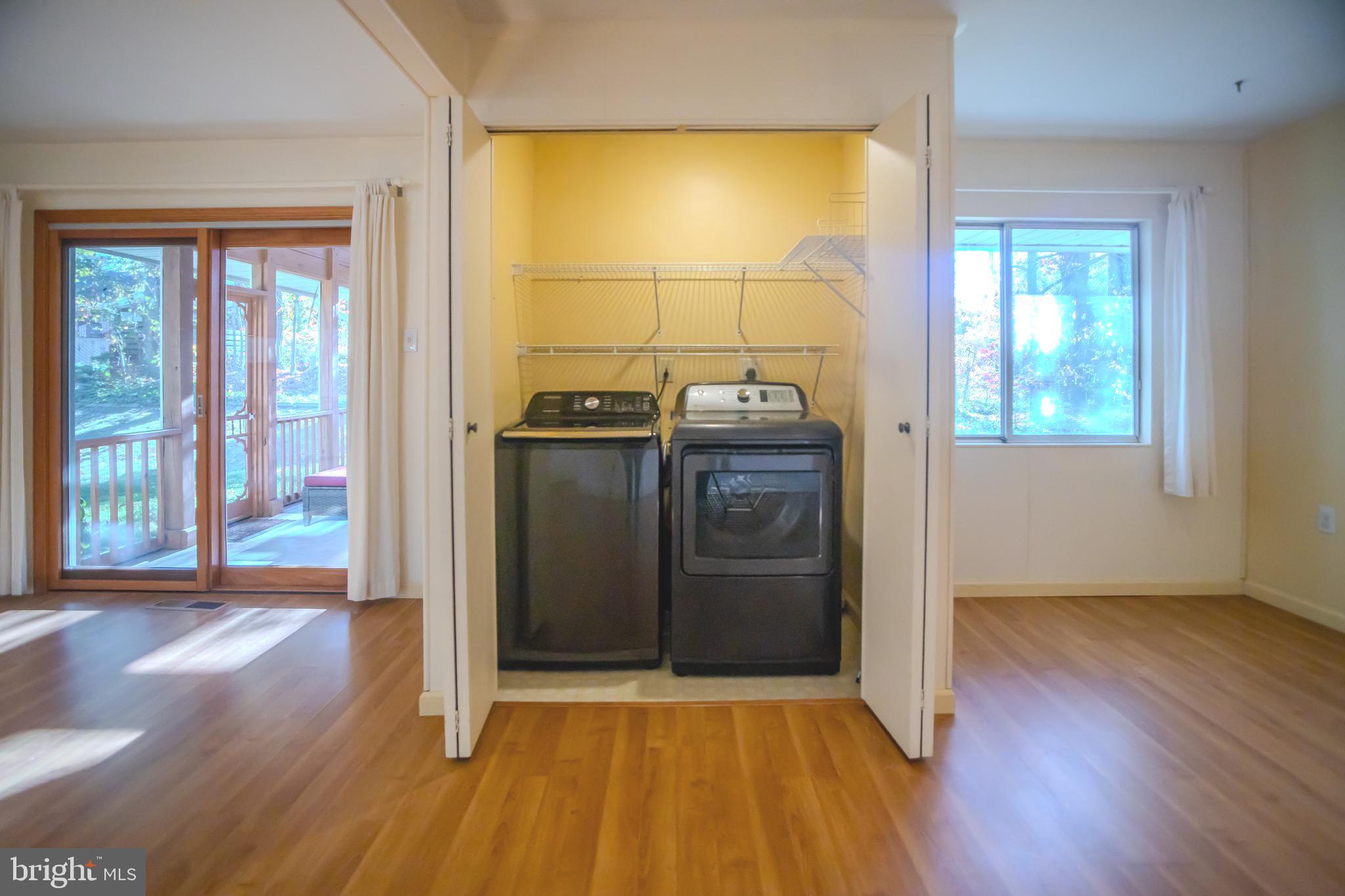 8815 Gramercy Lane Laurel, MD 20708 - Photo 31 of 42 an empty room with wooden floor and windows