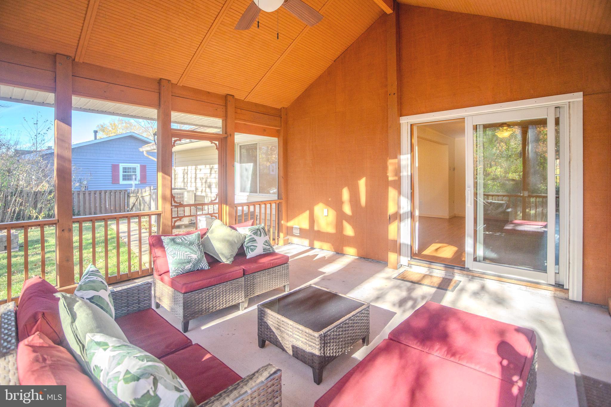 8815 Gramercy Lane Laurel, MD 20708 - Photo 35 of 42 a living room with furniture and a floor to ceiling window