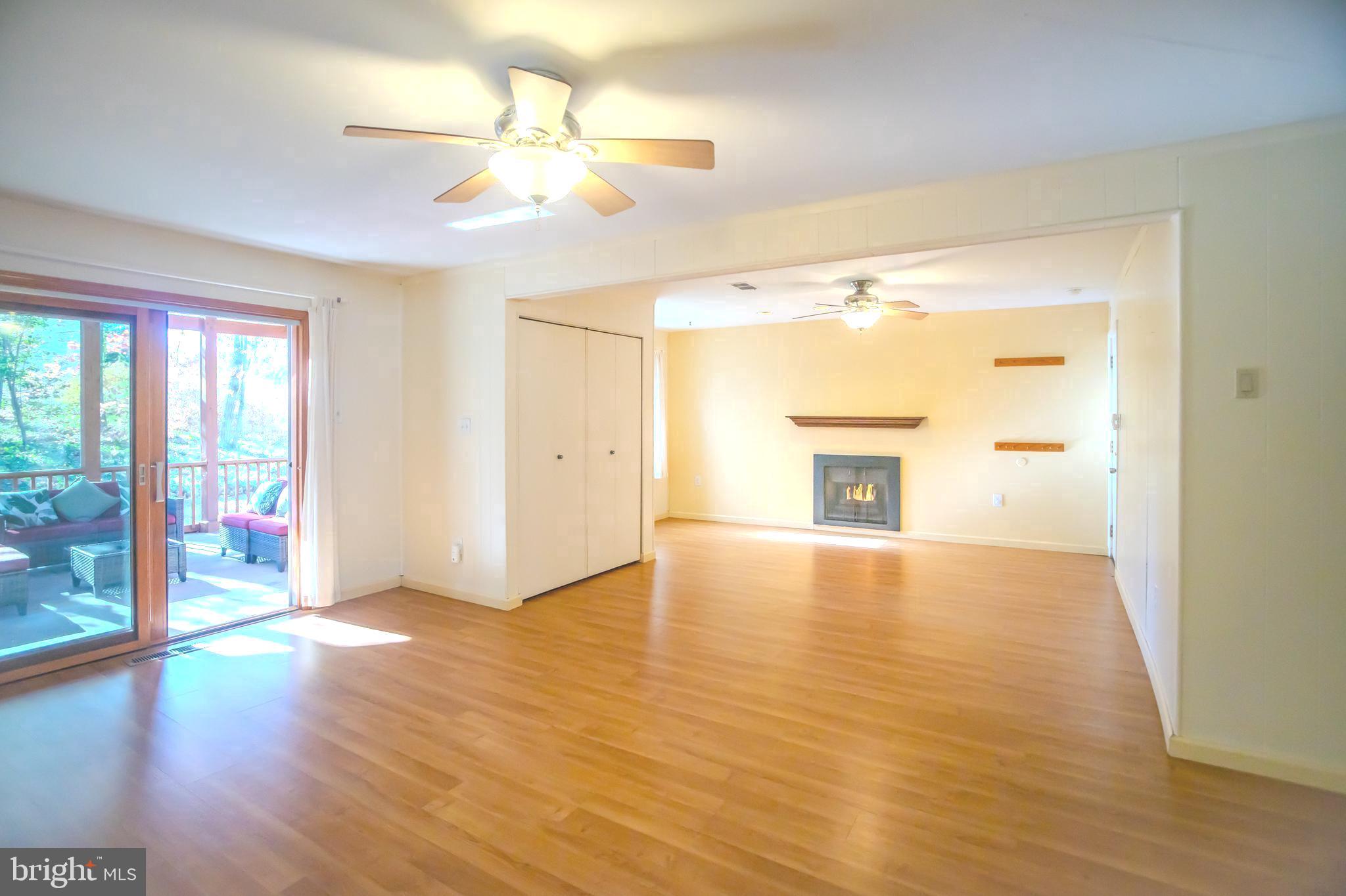 8815 Gramercy Lane Laurel, MD 20708 - Photo 6 of 42 a view of an empty room with window and wooden floor