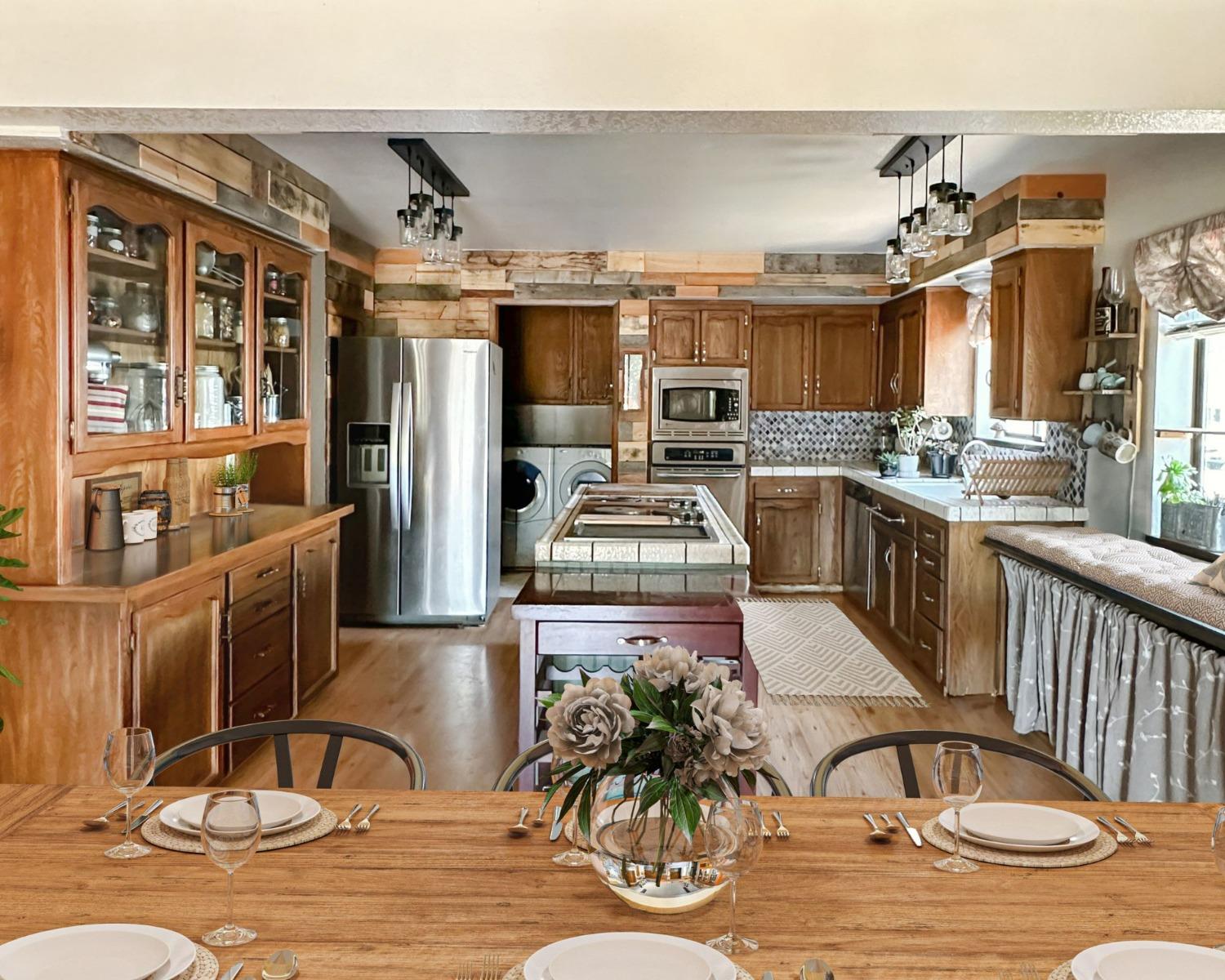 34125 Shaver Springs Road Auberry, CA 93602 - Photo 3 of 9 a kitchen with stainless steel appliances granite countertop a stove a sink dishwasher and cabinets with wooden floor