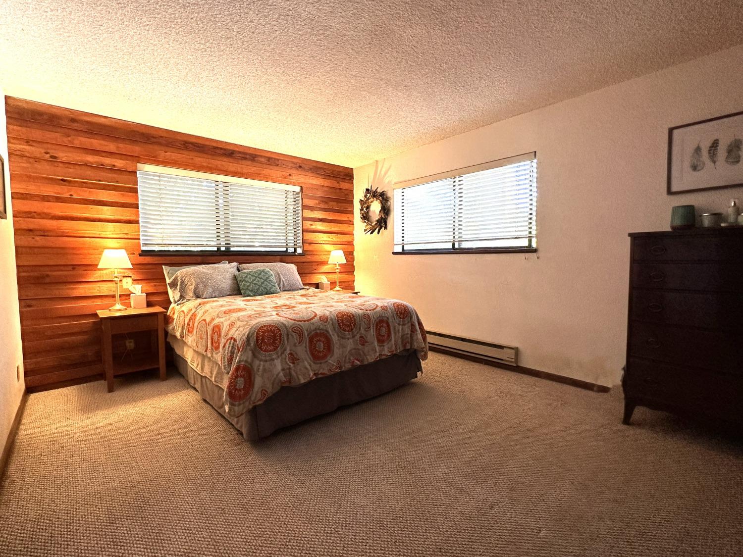 34125 Shaver Springs Road Auberry, CA 93602 - Photo 6 of 9 a bedroom with a bed and a television
